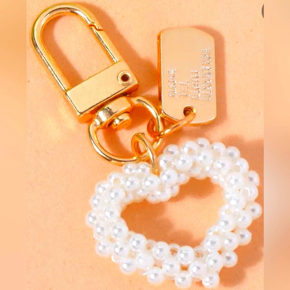 Brand new pearl like heart-shaped bag charm